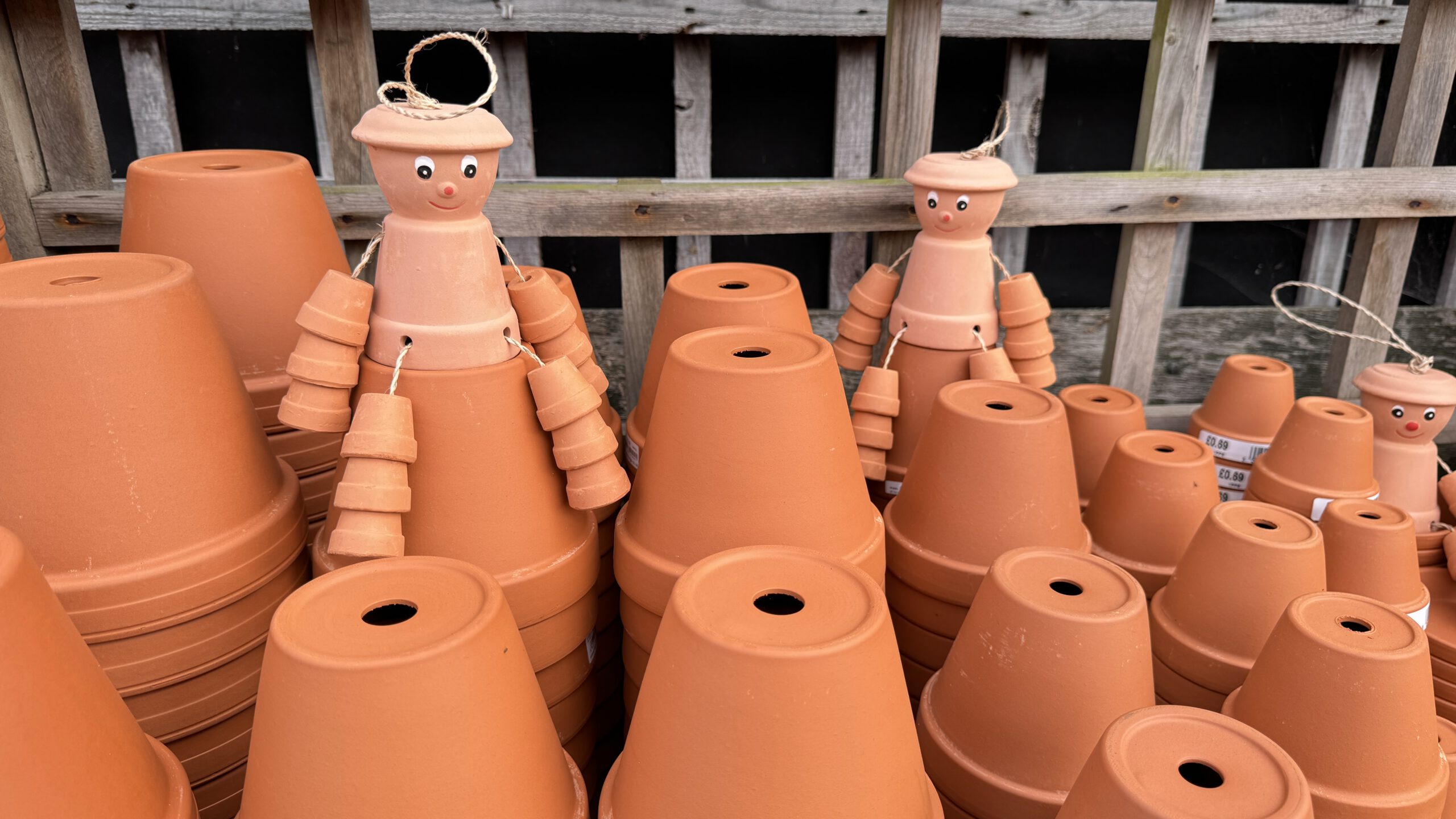 Two pot men on terracotta pots